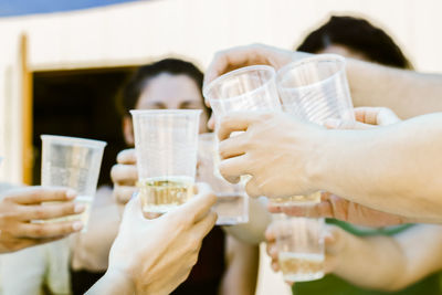 Group of people hands toasting