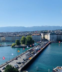 High angle view of bridge over river in city against clear sky