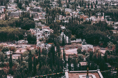 High angle view of townscape and trees in town