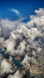 Aerial view of landscape against cloudy sky