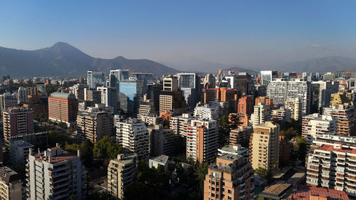 Aerial view of cityscape against sky during sunset