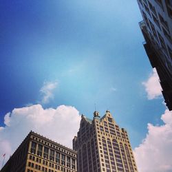 Low angle view of building against cloudy sky