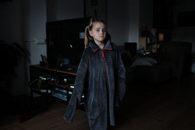 Portrait of young man sitting at home