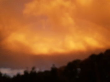 Low angle view of dramatic sky during sunset