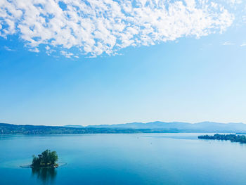 Scenic view of sea against blue sky