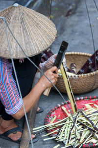 High angle view of people holding wicker basket