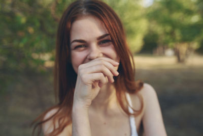 Portrait of young woman looking away