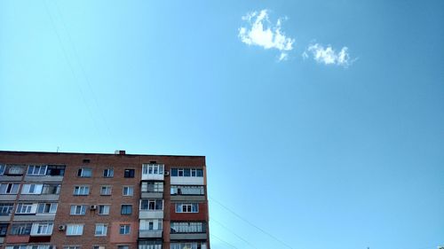 Low angle view of building against clear blue sky