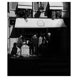 People standing in front of building