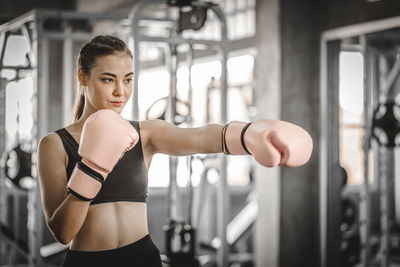 Full length of woman standing at home