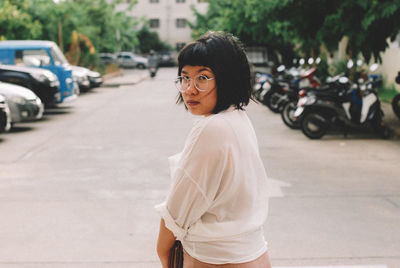 Young woman standing on street