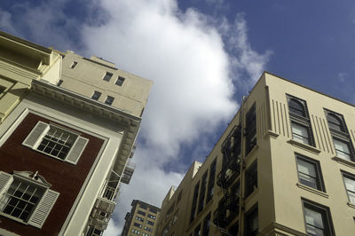 Low angle view of buildings in city against sky