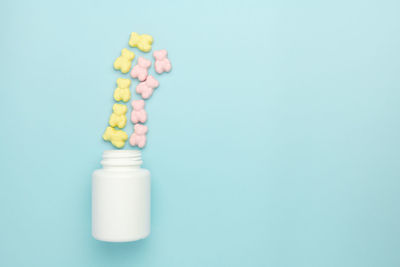 Close-up of blue bottle against white background