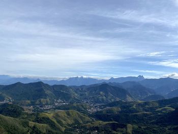 Scenic view of landscape and mountains against sky