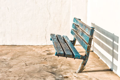 High angle view of empty chairs against wall