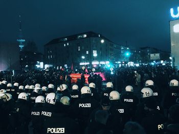 Crowd in city at night