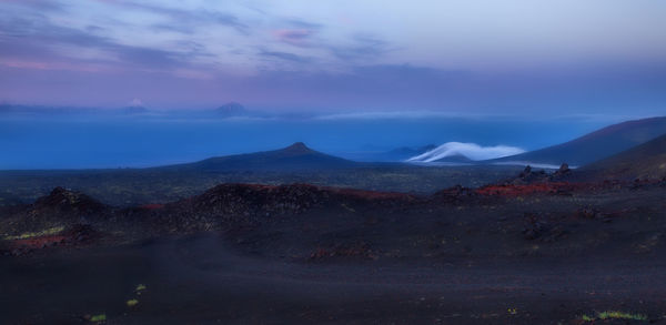 Panoramic view of volcanic landscape against sky