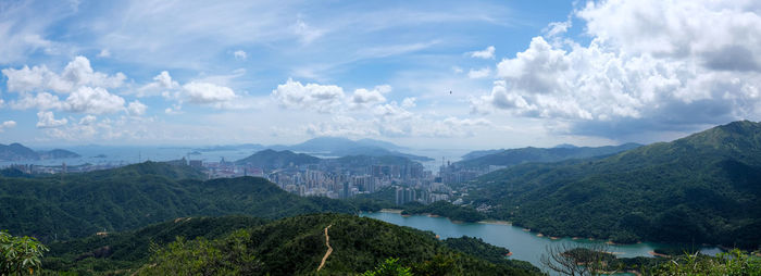 Panoramic view of trees and mountains against sky