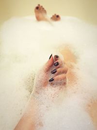 Midsection of woman in bathtub