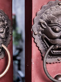 Close-up of metal door of building