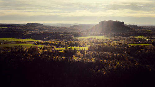 Scenic view of landscape against sky in saxon switzerland during sunset