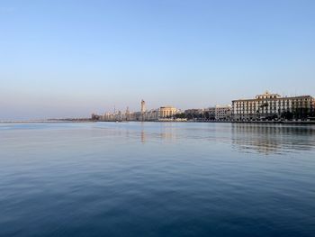 Scenic view of city bari against clear sky and sea