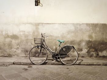 Bicycle parked against sky