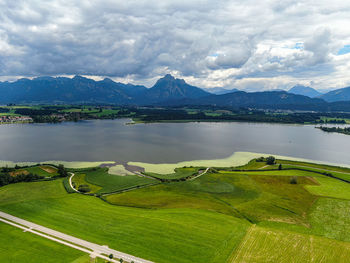 Scenic view of lake and mountains against sky