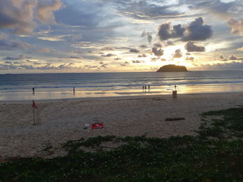 Scenic view of beach against sky during sunset