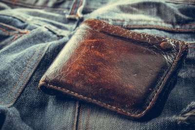 Close-up of wallet on denim