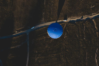 Aerial view of hot air balloon by road