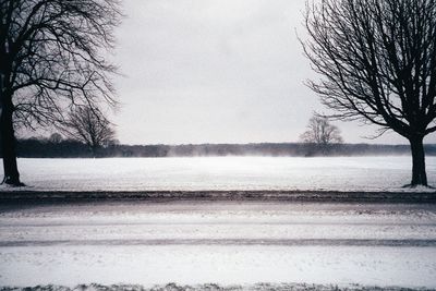 Scenic view of snow covered landscape against sky