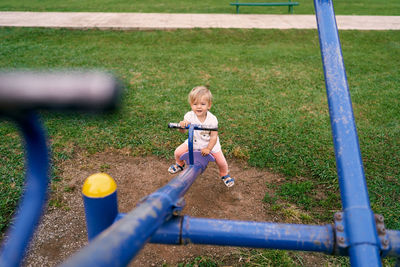 Full length of girl playing on playground