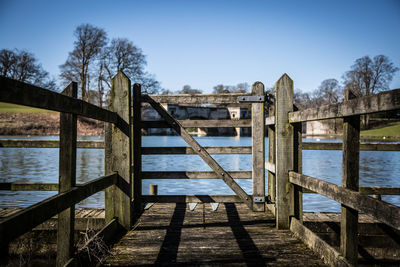 Scenic view of calm lake against blue sky