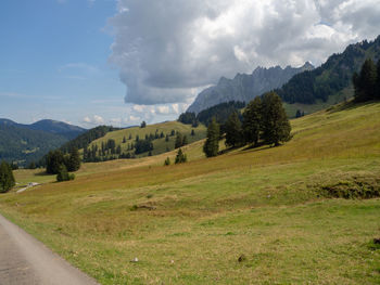 Scenic view of landscape and mountains against sky