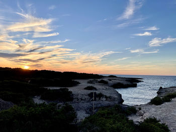 Scenic view of sea against sky during sunset