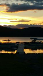 Scenic view of lake at sunset