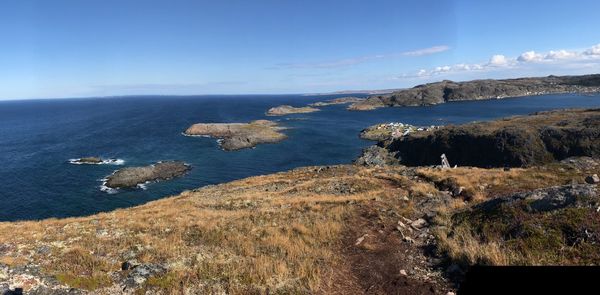 Scenic view of sea against blue sky