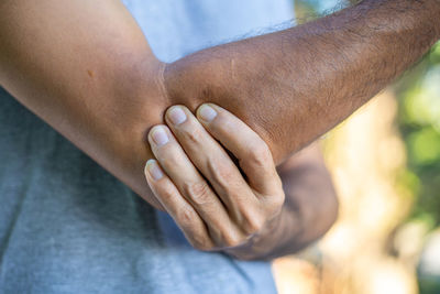 Close-up of hand holding hands