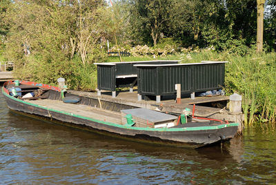 Boat moored in river