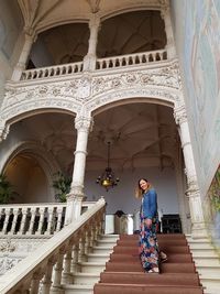 Woman on staircase of building