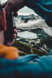 Man photographing mountains