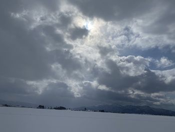 Scenic view of snow covered mountain against sky