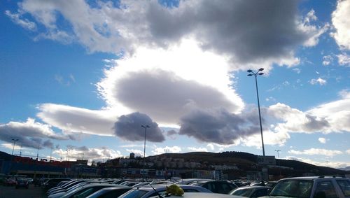 City street against cloudy sky
