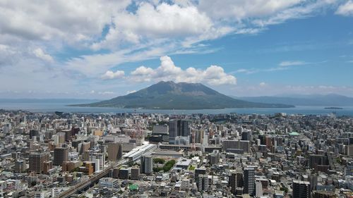 High angle view of city against cloudy sky