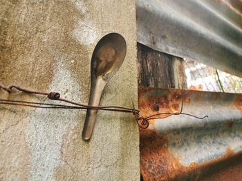 Close-up of rusty pipe on wall