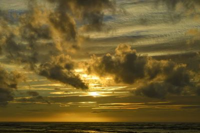 Scenic view of beach against sky during sunset