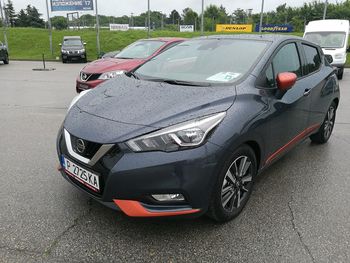 Cars parked on road in city