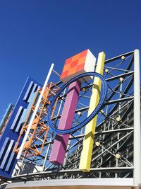 Low angle view of built structure against clear blue sky