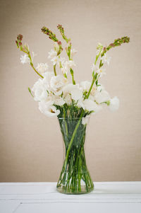 Close-up of white flower vase on table